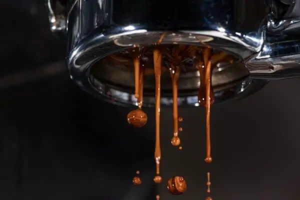 espresso coming out of a portafilter without spout