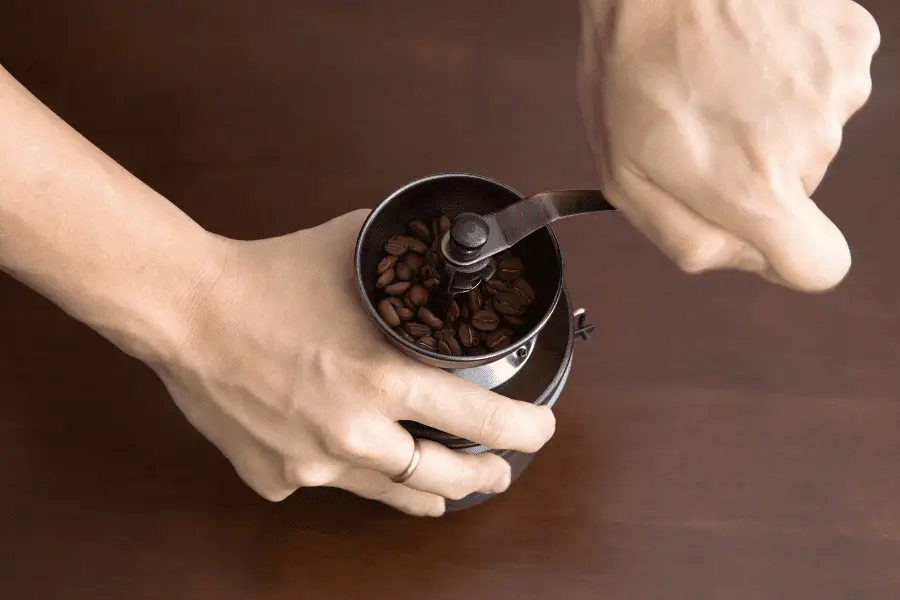 Hand grinder with beans