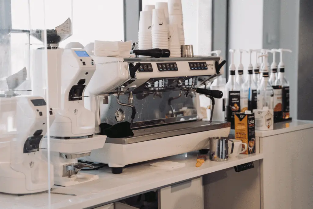 Image of a commercial espresso machine with separate grinder