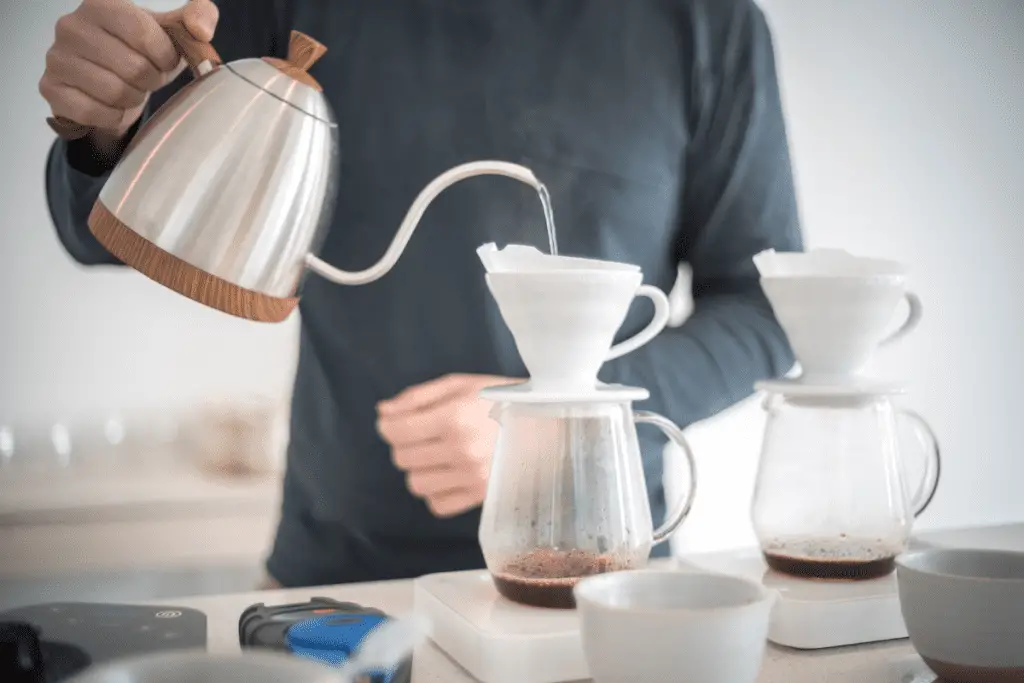 Image of a person brewing a v60 with gooseneck kettle