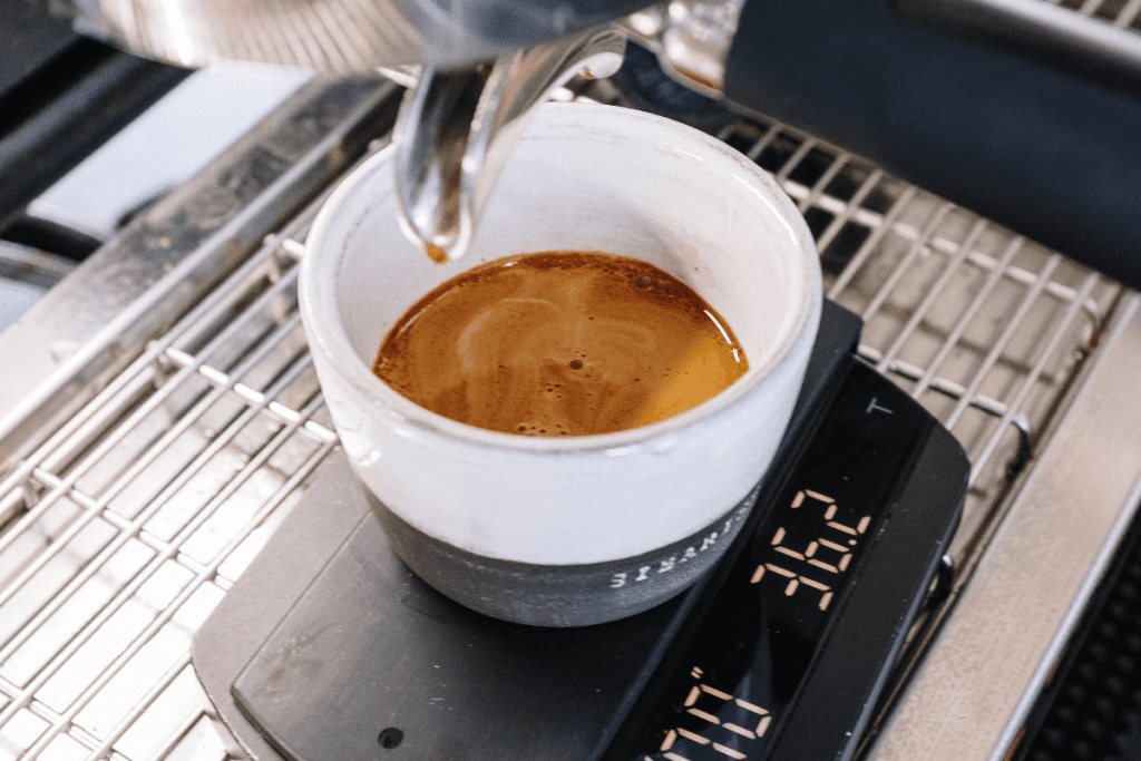 shot of espresso being weighed