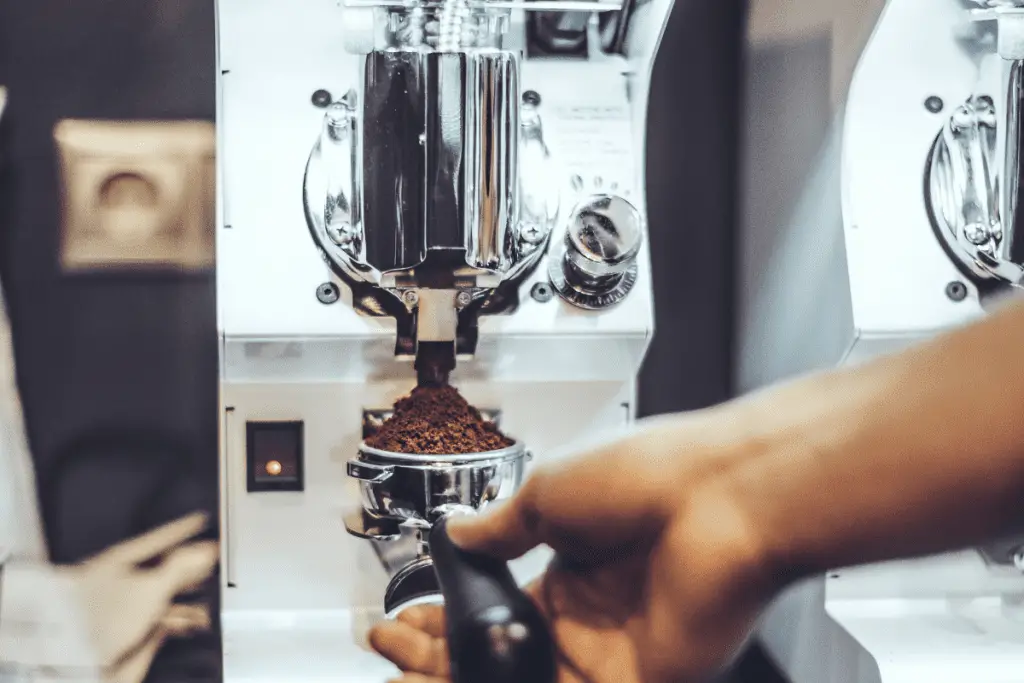 Picture of an espresso coffee grinder filling a portafilter