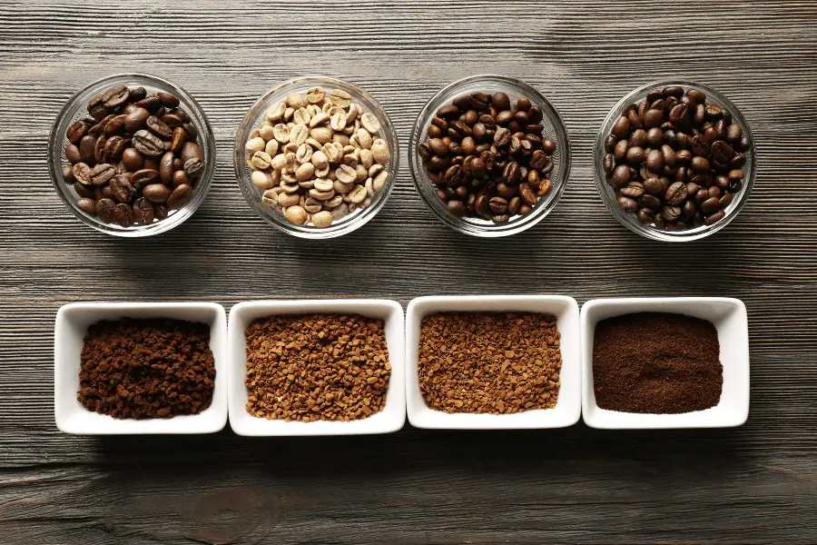 Image of different whole and ground coffee beans